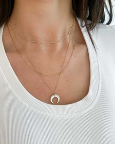 A lustrous mother of pearl in a crescent horn shape takes center stage on this unique necklace. Please note that this item cannot be shipped internationally. White 14k Gold Jewelry With Adjustable Chain, White 14k Gold Diamond Necklace With Clavicle Chain, White Diamond Necklace With 14k Gold Clavicle Chain, 14k Gold Necklace With Round Cut And Adjustable Chain, 14k Gold White Diamond Necklace With Clavicle Chain, White Jewelry With Delicate Chain And Round Shape, White Jewelry With Delicate Chain, Round Rose Gold 14k Gold Filled Necklaces, Rose Gold 14k Gold Filled Round Necklace