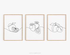 three framed art prints with fruits and vegetables on them