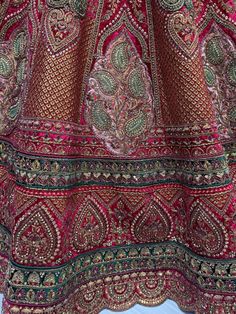 This exquisite ensemble features a rani pink color velvet material bridal lehenga with multi-thread work, sequin work, diamond work, zari work, velvet embroidered patchwork, and fancy dori work. The similar color velvet material choli is adorned with intricate multi-thread work, sequin work, diamond work, zari work, embroidered work, and fancy dori work. Complete your look with the matching net and velvet material double dupatta, featuring four sides of beautiful lace work and butta work all ove Embroidered Velvet Sharara For Festivals, Bollywood Style Velvet Traditional Wear For Reception, Festive Velvet Sharara With Intricate Embroidery, Traditional Velvet Sharara With Intricate Embroidery, Velvet Traditional Wear With Intricate Embroidery For Reception, Reception Traditional Velvet Wear With Intricate Embroidery, Velvet Traditional Wear With Dori Work For Reception, Velvet Sets With Intricate Embroidery For Festivals, Velvet Saree With Intricate Embroidery