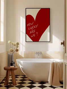 a bathroom with black and white checkered flooring and a red heart on the wall