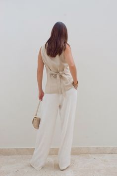 Color:Oat Woven vest Self tie front button up closure Square neckline Self tie back detail Self: 55% Linen 45% Rayon Lining: 100% Cotton Back Details, Square Necklines, Tie Backs, Tie Back, Square Neckline, Skirt Pants, Dress Pants, Button Up, Square