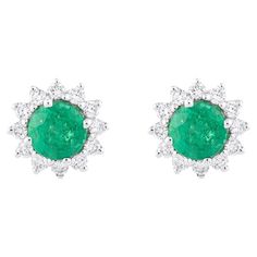 Step into a world of sophistication and elegance with our 18 Karat Gold 1.29 Carat Diamond and Emerald Solitaire Stud Earrings. Each of these pieces is a unique testament to expert craftsmanship and thoughtful curation, celebrating a seamless blend of tradition and contemporary allure. These remarkable stud earrings feature 1.29 carats of dazzling diamonds and enchanting emeralds set in 18 karat gold. The fusion of these exquisite gemstones creates an unparalleled allure, exuding sophistication Formal Emerald Earrings With Prong Setting, Gia Certified Emerald Earrings For Formal Occasions, Emerald Round Cut Earrings For Anniversary, Round Cut Emerald Earrings For Anniversary, Formal Round Cut Gemstone Earrings, Classic Emerald Earrings With Halo Design, Elegant Round Cut Emerald Earrings, Luxury Round Emerald Diamond Earrings, Emerald Earrings With Brilliant Cut For Anniversary