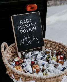 baby makin'potton make money sign in wicker basket with chalkboard