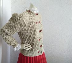 a mannequin dressed in a sweater and skirt