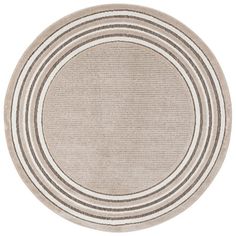 a round rug with stripes on the center and bottom in beige, grey and white