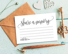 a card with the words share an memory on it next to some keys and other items