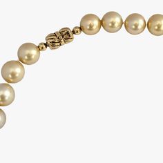 Indulge in the elegance and natural beauty of this stunning South Sea pearls necklace, featuring cultured Golden South Sea pearls sourced from Indonesia. Crafted with meticulous attention to detail, this necklace is a testament to exceptional craftsmanship and exquisite materials. Secured with a 14K yellow gold 'twist and lock' clasp, the necklace measures 17.25 inches (43.5cm) in length, draping gracefully around the neckline. The weight of 95.7g adds a substantial feel and underscores the luxu Fine Pearl Jewelry, South Sea Pearl Necklace, Golden South Sea Pearls, Pearls Necklace, Sea Pearl, South Seas, Sea Pearls, South Sea Pearls, Pearl Jewelry