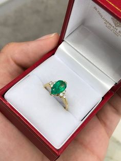 This ring features a 1.06-carat natural Colombian emerald, pear cut from the famous Muzo mines. Set in a secure two-prong setting, this extraordinary emerald has a stunning green color and very good eye clarity, Minor imperfections are normal for genuine Colombian emeralds. Three brilliant round diamonds accent the emerald on either side. Excellent colorless diamonds with VS clarity highlight the pear cut emerald. Set in silky 18K yellow gold. Perfect for everyday wear. Metal Purity: 18K Yellow Teardrop Emerald Ring With Prong Setting, Green Pear-shaped Emerald Ring For Anniversary, Fine Jewelry Emerald Ring With Pear Gemstone, Pear-shaped Emerald Ring In Fine Jewelry Style, Pear-shaped Emerald Ring, Fine Jewelry, Pear-shaped Emerald Ring For Promise, Teardrop Emerald Ring In Yellow Gold, Pear-shaped Emerald Ring For Anniversary, Pear-shaped Emerald Anniversary Ring