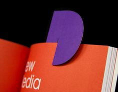 an orange book with a purple heart on the cover and we didn't read it