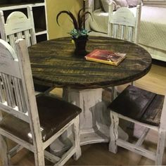 a table with two chairs and a book on it