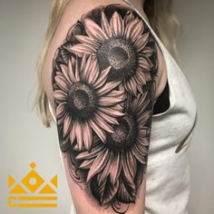 black and white sunflowers tattoo on the right arm, shoulder and upper arm