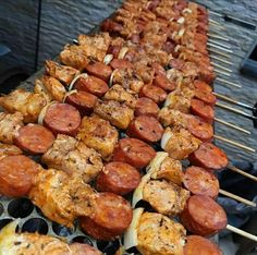 several skewers filled with different kinds of food