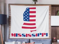 a mississippi state flag hanging on the wall in a living room