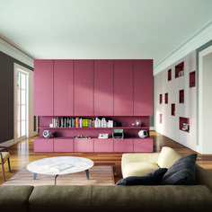 a living room filled with furniture and pink walls