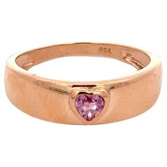 Dainty Heart Cut Pink Sapphire Pinky Ring Signet Ring in 18K Gold featuring natural pink sapphire of 0.26 carats. The gorgeous handcrafted ring goes with every style, every occasion or any outfit. Pink sapphire helps strengthen and balance the heart. Designed with heart cut pink sapphire studded in center in a dome ring of solid gold that makes it a perfect fit to wear it on your occasion or style it with any of your basic outfit to give it a glam. This is a perfect Pink Sapphire Signet Ring. It Sapphire Signet Ring, Mother Daughter Gifts, Sapphire Studs, Outfit Pink, Gold Gemstone Ring, Dome Ring, Gold Signet Ring, Heart Gemstone, Perfect Pink