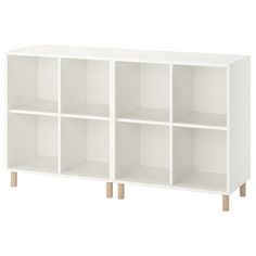 a white bookcase with four shelves on one side and two wooden legs in the other