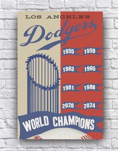 the los angeles dodgers world champs poster on a brick wall