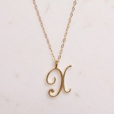 X Initial Necklace - Cursive "X" initial - Initials Necklace for Women - Gold initials necklace - Women's Monogram Necklace - gift for her Dainty "X" initial. Perfect every day necklace. Lovely gift for your self, sister, bridesmaids, new mom. Pendant: Base metal is brass and 14K gold plated. Chain is 18 inches, 14k gold filled. (if you would like a longer or shorter chain, please contact us to customize it) Note: model shots might show a different initial, only to illustrate overall look and... Letters Cursive, X Initial, Every Day Necklace, Diamond Circle Necklace, Initials Necklace, Double Horn Necklace, Gold Letter Necklace, Letter X, Jewelry Clothing