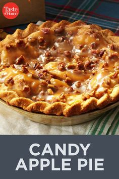 a close up of a pie on a table with the words candy apple pie in front of it