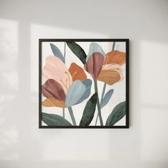 an abstract floral painting hangs on the wall