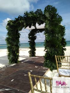 an outdoor ceremony set up on the beach