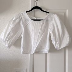 Nwt H&M Cropped Blouse. Size Medium. Never Worn. Color White. Button Detailed In Back As Shown. Elastic Crop Detail Bottom Of Top As Shown. Spring Button-up Cotton Puff Sleeve Top, Spring Cotton Puff Sleeve Button-up Top, H&m Short Sleeve Work Tops, H&m Short Sleeve Tops For Work, White Cropped Cotton Puff Sleeve Top, White Cotton Cropped Puff Sleeve Top, H&m Button-up Blouse For Day Out, H&m Spring Shirt, H&m Blouse For Summer Workwear