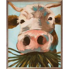 a painting of a cow's face is shown in the middle of a frame