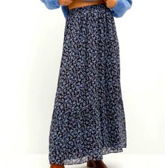 This Skirt Is Nwt. It’s A Light Blue Floral On Brown Background. The Chiffon Is Soft And It Is Fully Lined. It Fits Tts. You Can Wear This Skirt Year Round. Wear This With A White T-Shirt And Denim Jacket Throw On Some Espadrilles And Your Set For Spring/Summer. For A Fall/Winter Look Pair This With A Soft Cream Sweater And Brown Riding Boots. Blue Lined Maxi Skirt For Fall, Blue Pleated Maxi Skirt For Fall, Blue Skirted Bottoms For Fall, Blue Relaxed Maxi Skirt For Fall, Blue Bottoms For Fall Vacation, Blue Bottoms For Vacation In Fall, Mango Skirts, Brown Riding Boots, Floral Maxi Skirt