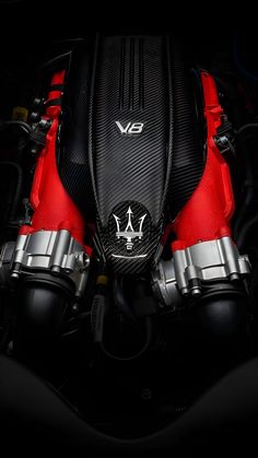 the engine of a red and black sports car