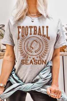 FOOTBALL SEASON,GAME DAY UNISEX SHORT SLEEVE,GRAPHIC TEE,GRAPHIC TSHIRTS,TSHIRTS,TEES100%COTTON,HEATHER(52%COTTON,48%POLY),ATH.HEATHER,BLACK HEATHER(90%COTTON,573%POLY)NICARAGUAMade In: NicaraguaSize Measurement (inch): S: 36 (BUST), 18 (WAIST), 18 (HIPS), 28 (LENGTH) M: 40 (BUST), 20 (WAIST), 20 (HIPS), 29 (LENGTH) L: 44 (BUST), 22 (WAIST), 22 (HIPS), 30 (LENGTH) Gray T-shirt For College In Fall, Sporty Gray T-shirt For Fall, Casual Gray T-shirt For Sports Events, Gray Sporty T-shirt For Fall, Fall T-shirt With Text Print For Sports Events, Fall Team Spirit Short Sleeve T-shirt, Team Spirit Short Sleeve T-shirt For Fall, Short Sleeve Sports Tops For Fall, Football Season