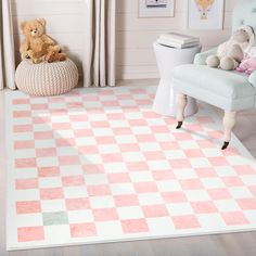 a pink and white checkered rug in a child's room with teddy bears