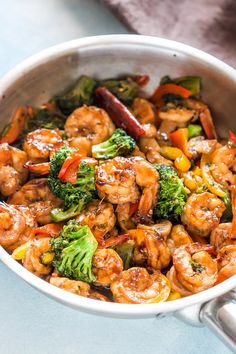 shrimp and broccoli stir fry in a skillet with the title above it