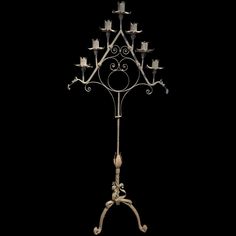 an iron candelabra with candles on it