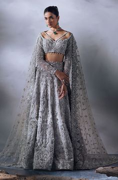 Honey Waqar Grey Bridal Lehenga Choli and Dupatta Dress is a stunning attire adorned with Lavish designs and Hand-crafted embellishments. Fast shipping. Engagement Clothes, Party Lehenga, Pakistani Bridal Lehenga, Hanging Tassels, Pakistani Bridal Dress, Printed Organza, Bridal Dupatta, Hijab Wedding Dress, Pakistani Wedding Dress