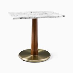 a marble and brass pedestal table with a wooden base on an isolated white background,