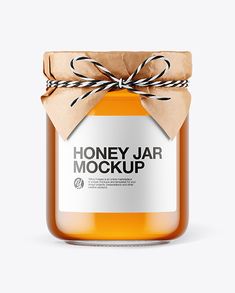 a jar of honey jar mockup with a brown ribbon around the lid and label