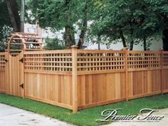 a wooden fence in front of a house