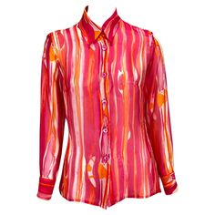 Presenting a sheer silk button-up top designed by Tom Ford for Gucci's Spring/Summer 1996 collection. This 1970s-inspired collection featured the same blouse in blue in the runway presentation and in the season's ad campaign, shot by Mario Testino. The silk organza features a bright orange, pink, and white watercolor print with the Gucci logo peppered throughout. Add this pop of color to your wardrobe, also available in smaller sizes! Approximate measurements: Size - IT42 Shoulder to hem: 25” Bu Gucci Shirts Men, Gucci Blouse, Gucci By Tom Ford, Tom Ford Gucci, Gucci Shirt, Gucci Spring, White Watercolor, Silk Button Up, Mario Testino