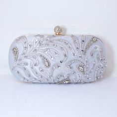 New to our Millennium collection, This beautiful romantic Beige crystal leaves embroidered and beads bridal clutch bag is made of very fine quality of crystal, beads rhinestones, fabric and metal and it comes with two chains, one chains length is 15 inches for a shoulder bad 44 inches long os cross body bag Detachable chain for your Big day! ► ABOUT YOUR ORDER * All items are neatly packaged in our beautiful jewelry boxes and elegant organza bags. * All items are 100% gift-ready. * Each order co Elegant Silver Embroidered Bags, Rectangular Embroidered Evening Bag For Wedding, Elegant Wedding Bags With Pearl Embroidery, Hand Embellished Wedding Bags, Elegant Evening Bag With Pearl Embroidery For Wedding, Glamorous Handwork Clutch For Weddings, Glamorous Wedding Bags With Pearl Embroidery, White Embroidered Evening Bag For Wedding, Rectangular Hand Embellished Wedding Bag