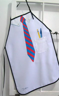 an apron with a tie and pencils on it