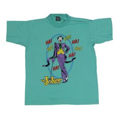 Original 1989 Joker DC Comics Shirt. This is a true vintage shirt, not a modern reproduction. Sizes vary so please use measurements for best idea on fit. No back graphics. Shirt is in good condition, no holes, discoloration on back. This shirt comes laundered and ready to wear. Tag Size: Large Material: 50/50 Poly/Cotton Pit to Pit: 20.75 inches Collar to Hem: 27 inches Michael Jackson Bad Tour, Dc Comics Shirts, Graphics Shirt, Jordan Shirts, Concert Shirts, Kansas City Mo, Rock Shirts, Crew Shirt, Tour Shirt