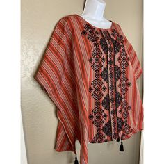 Andree By Unit Sz M Embroidered Red And Black Poncho Top With Tassels Euc. Purchased And Never Worn Smoke Free Pet Friendly Home 9 Red Bohemian Poncho For Festival, Traditional Top With Kimono Sleeves, Red Cape Poncho For Festival, Red Bohemian Poncho With Fringe, Red Folk Style Poncho For Festival, Red Floral Embroidered Kaftan For Festival, Embroidered Red Blouse For Vacation, Embroidered Cotton Red Kaftan, Red Embroidered Cotton Kaftan