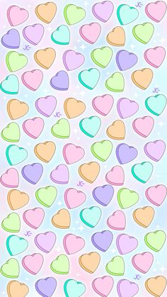 many different colored hearts on a blue background