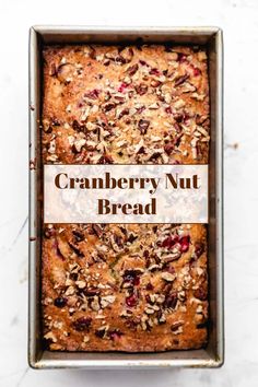 a loaf of cranberry nut bread in a pan with the title above it