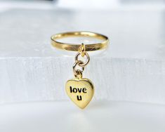 Showcase your love with this dainty "love u" heart charm ring with your choice of a textured, smooth or thin 14k gold-filled band. This exquisite charm ring, meticulously crafted, is an emblem of affection, making it the perfect gift for Valentine's Day, Mother's Day or as a promise ring.  ✦100% handcrafted ✦ High quality 14k gold-filled metal ✦ Ring arrives in either a pink microfiber suede envelope/pouch or a blue/green drawer cardboard box as seen in the last image of this listing. ✦ Ready to Green Drawer, Dainty Promise Ring, Envelope Pouch, Valentine Jewelry, Romantic Rings, Charm Ring, Wedding Romantic, Gift Girlfriend, Jewelry Dainty