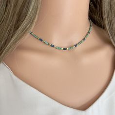 ✦This cute beaded boho choker necklace is made with dainty opaque turquoise green Miyuki seed beads that measure 3mm in diameter. The beads are strung on sturdy beading wire, with either silver or gold seed beads Interspersed among the beads to give a classic look. ✦The necklaces closes with a lobster clasp and 1.5 inch section of chain to allow for an adjustment in length.  ✦Available in either 14k gold filled or sterling silver finish. ✦Comes in lengths from 14 inches to 20 inches. Please select necklace length and finish (14k gold filled or sterling silver) at check out.  ✦Longer and custom lengths available on request - please message seller. ✦Your jewelry will be packaged in a beautiful and reusable organza bag. All items will be placed in the same organza bag. If you need a separate Boho Choker Necklace, Diy Jewelry Projects, Boho Choker, Jewelry Card, Turquoise Green, Beading Wire, Seed Bead Necklace, Beaded Choker, Summer Jewelry