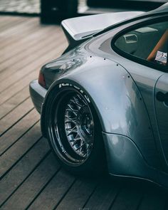 a car parked on top of a wooden floor