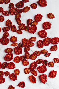 sliced up tomatoes on a white counter top