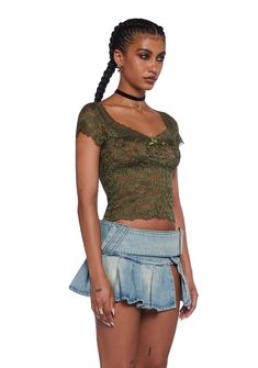 This top has a stretchy sheer lace construction, a small velvet bow applique in front, lace detailing, cap sleeves, and a crop fit. Casual Green Lace Top, Green Lace Party Top, Green Lace Trim Top For Party, Current Mood Clothing, Boho Whimsical, Bow Applique, Bow Shorts, Skirts With Boots, Pride Outfit