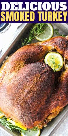 a roasted turkey in a pan with lemons and herbs on the side that says delicious smoked turkey